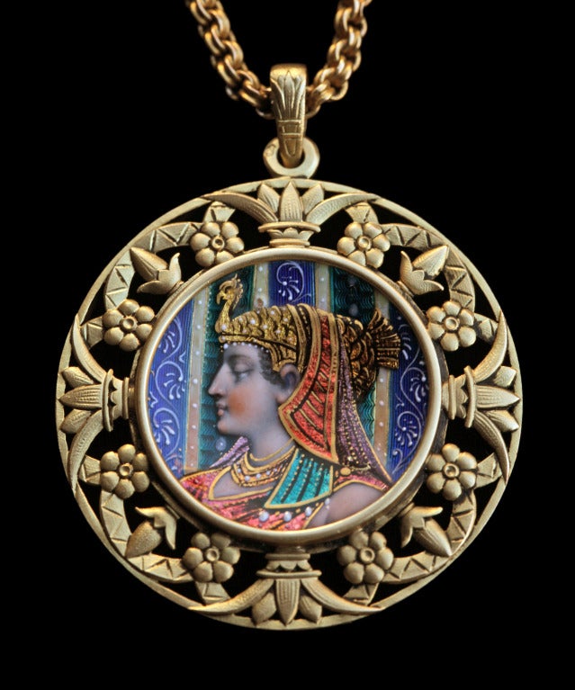 Egyptian Revival pendant in gold & enamel depicting a portrait of Cleopatra
Pendant: H: 4.8 cm (1.89 in)  W: 3.8 cm (1.5 in)  Chain: L: 40.5 cm (15.94 in) 
Marks: Eagles head & maker's mark 'D & Cie'
Our price is fully inclusive of