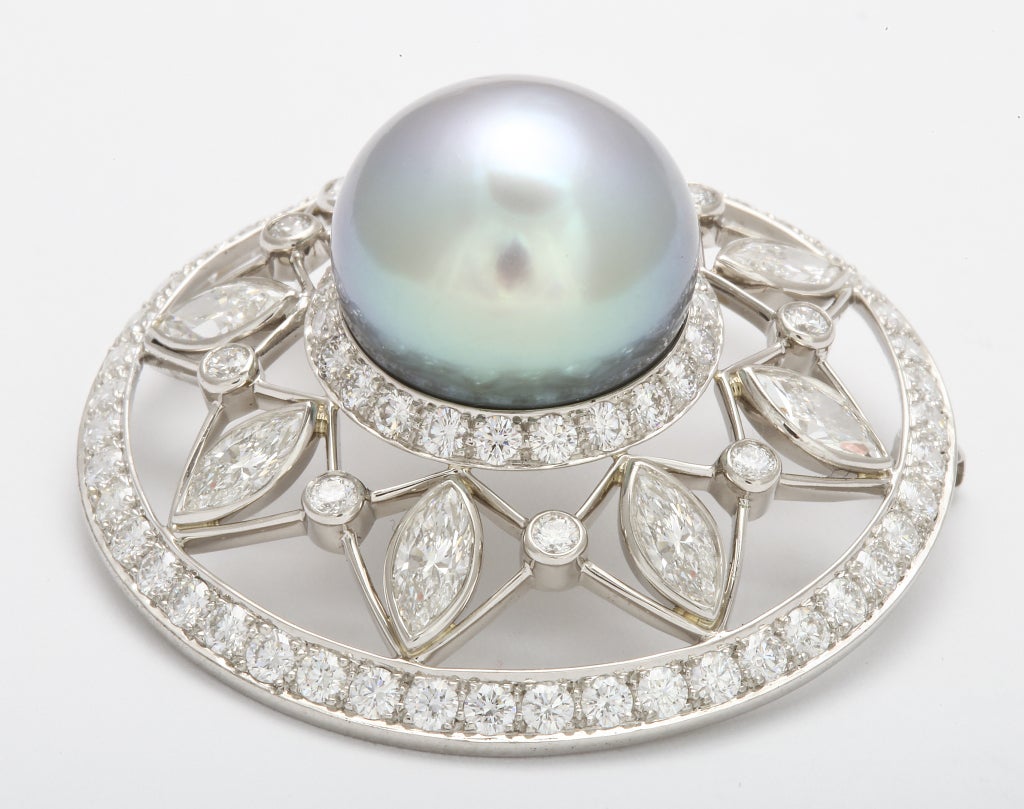 TIFFANY Pearl Diamond Brooch
Extremely rare Tiffany cultured Tahitian pearl is accented here by gemstones which highlight the pearl's exotic color.
