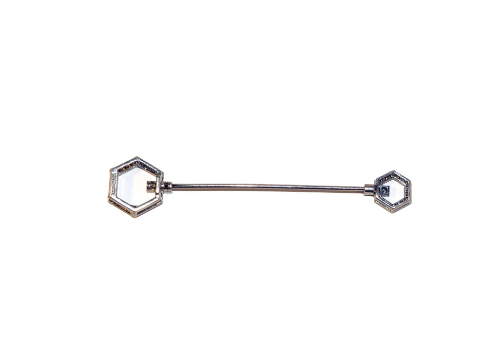 A fine quality 20th century jabot pin of hexagonal shape set with small brilliant cut diamonds and mounted in platinum by Tiffany and Co.