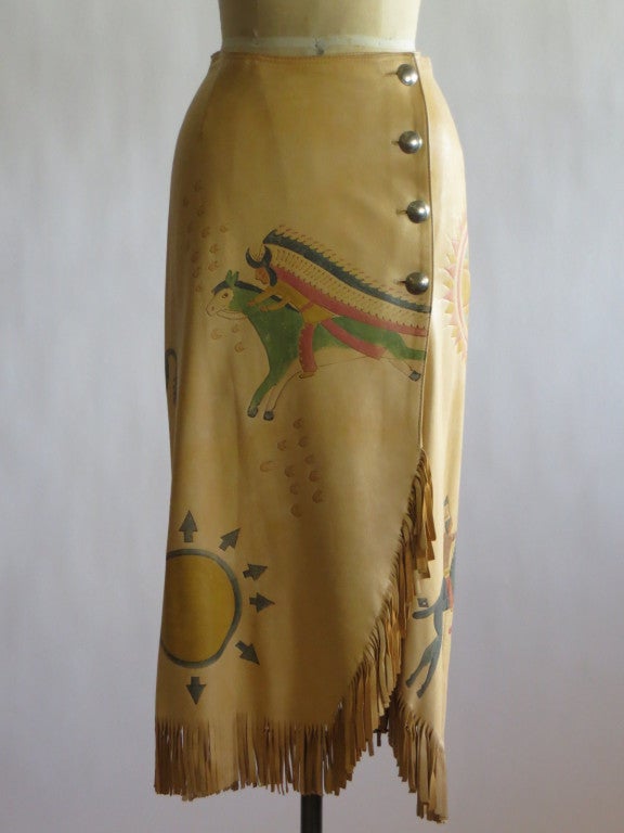 A south western motif painted in the style of the Native American ledger paintings on leather wrap skirt. 1980's