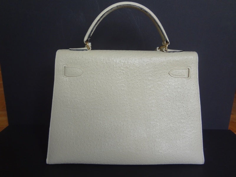 Extraordinary, rare and Authentic Hermès Kelly 32 in Whale leather.

Stamp B

This Hermès Kelly is in very good condition and very clean.

It is in WHALE leather in white color. Nowadays, it is absolutely IMPOSSIBLE to have a Hermes bag in