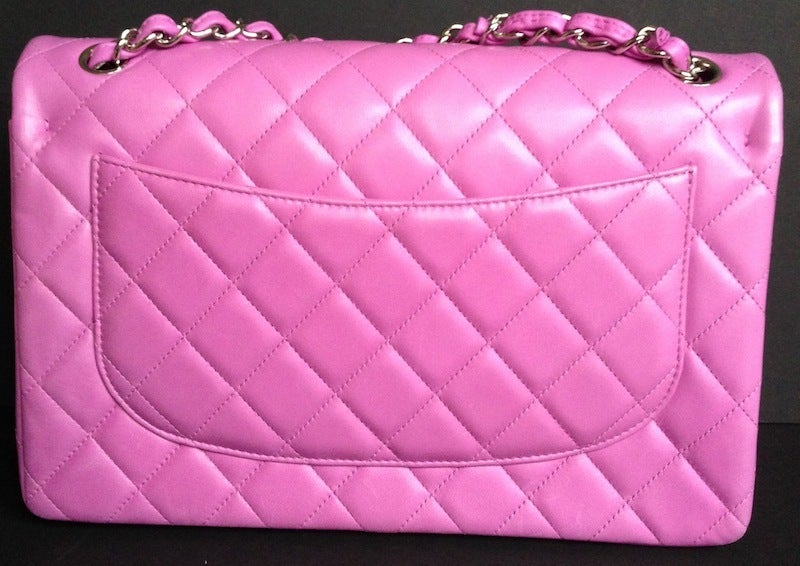 Chanel Timeless Pink flap Jumbo size
Lamb skin with palladium hardware
Pink - mauve color
Shoulder chain for cross body wearing
As new condition
This Chanel Timeless comes from private access to private Chanel staff sales. It is absolutely 100%