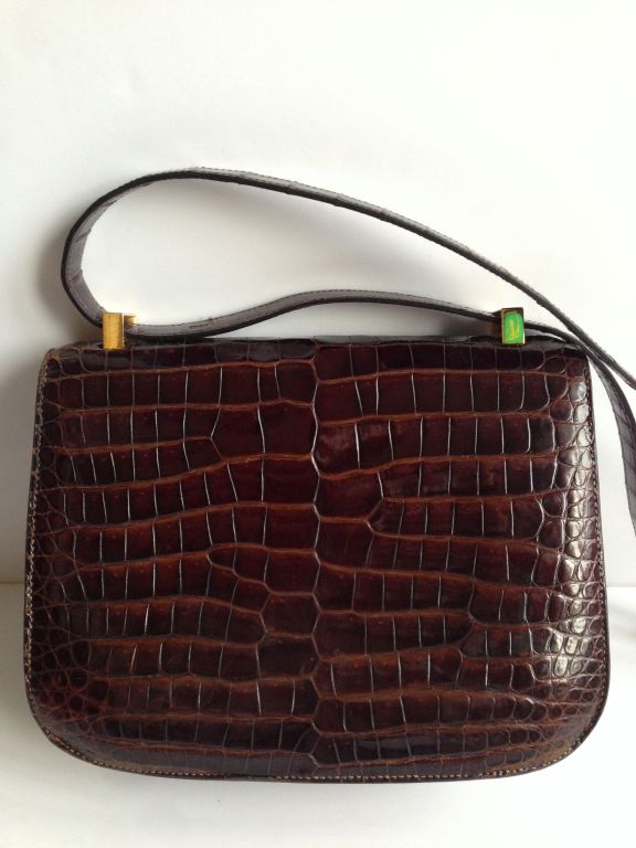 Hermes Constance 23 Crocodile Porosus
 
Miel crocodile Porosus
 
Gold hardware
 
Hermes Paris
Made in France
 
This Hermes Constance is in very good condition
Hermes clasp and the inside zipper are in perfect working
No water marks on the