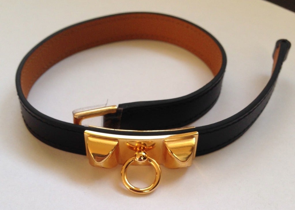 Hermes Rivale bracelet 

Black barenia leather 

Gold plated hardware 
Hermes Paris Made In France

Stamp Q 2013

New condition – Never worn

Dimensions : 14,25 x 0,4 inches 
It comes with a box and pouch

All ours items are 100%