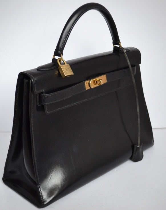 Hermes Kelly 32 Black box with gold hardware and crocodile strap 1