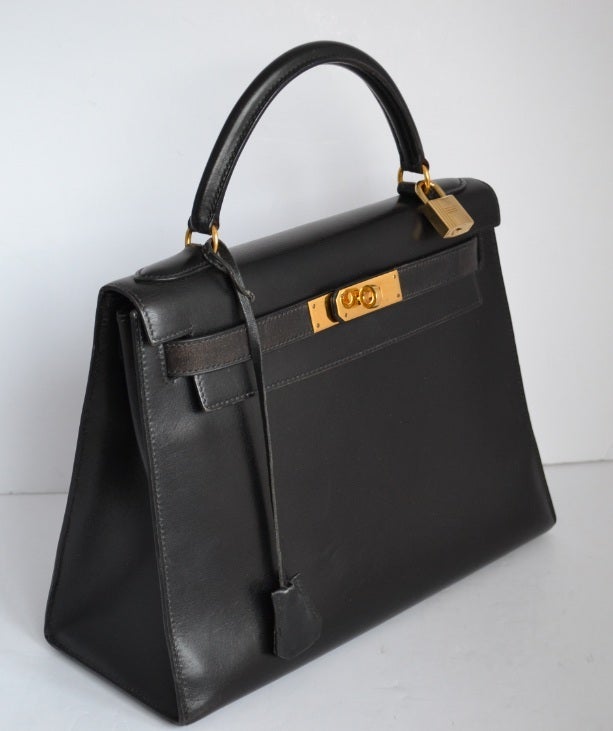Hermes Kelly 28 black box with gold hardware at 1stdibs