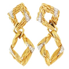 Pair of  gold and diamond pendant-earclips