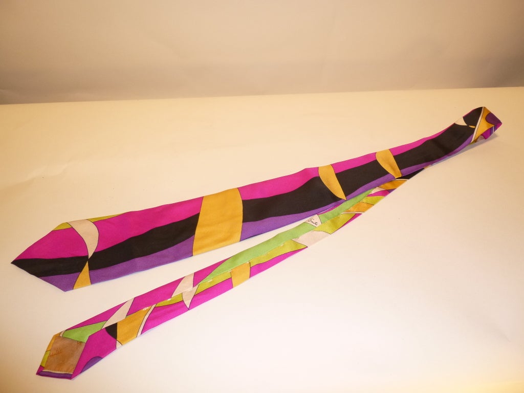 Distinguished and classic 60s Emilio Pucci mens neck tie, in a signature 100% silk fabric, with the iconic stitching on the back, present in Pucci ties from this era. Black, purple, white, light orange, pink and seafoam green - this tie will go with
