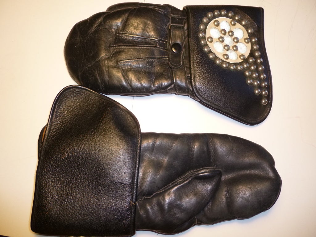 Late 40's or early 50s motorcycle riding gloves. There are other versions of these around, but none of them have the customized studwork that these sport. The glove itself is lined in a thick shearling while the leather is quite soft and supple. The