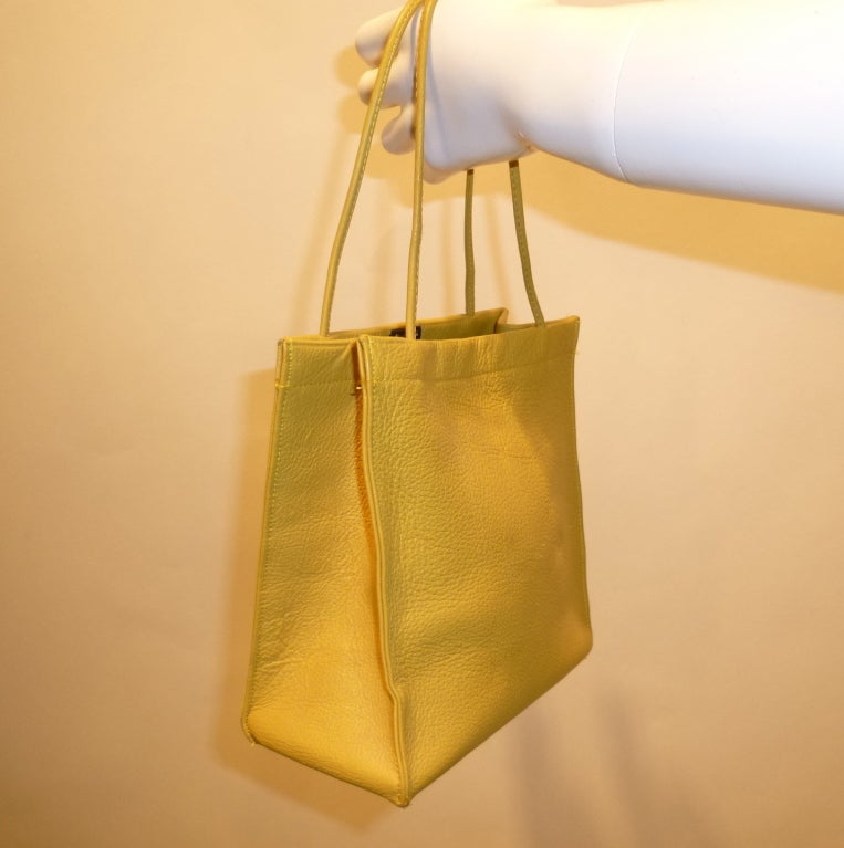 Bonnie Cashin joined Coach in 1963. She won her second Coty Award in 1968, a direct result of the line these bags come from. This is a deadstock (new-old) butter soft celery green leather handbag. There is no hangtag, but it is from a lot of