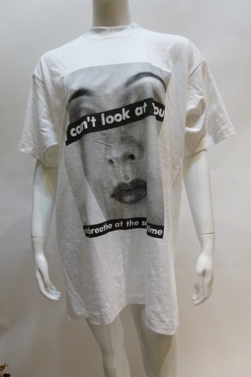 This is a mid to late 1980s WilliWear WilliSmith T Shirt fearuring an iconic Barbara Kruger image, which is not credited. WilliWear WilliSmith glyph on the sleeve.

Stated size XL. Bust: 23