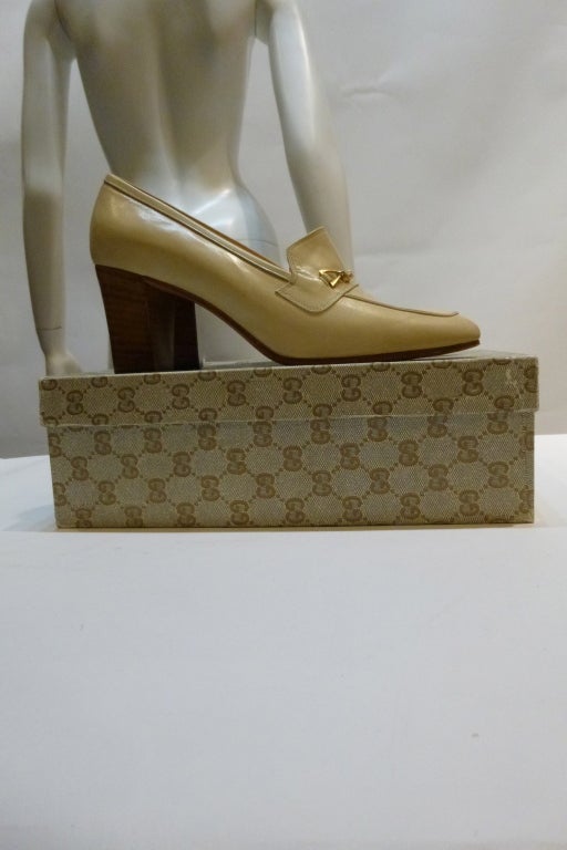 Wonderful Gucci loafer uppers with elegant  wooden stacked heels, in original box. Patent leather upper, leather sole and lining. They have not been worn - the soles are untouched. The brass bridle accent on the vamp features the logo. See