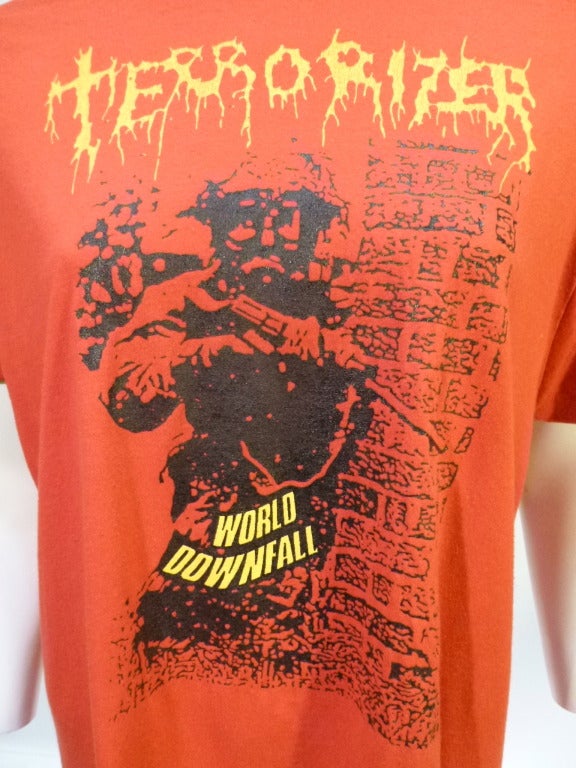 Terrorizer was a grindcore/death metal band active in the 80s out of LA. This tee shirt is for World Downfall, which is the sole LP released during the pre 2000s reunion records.

No stated size. Bust: 21