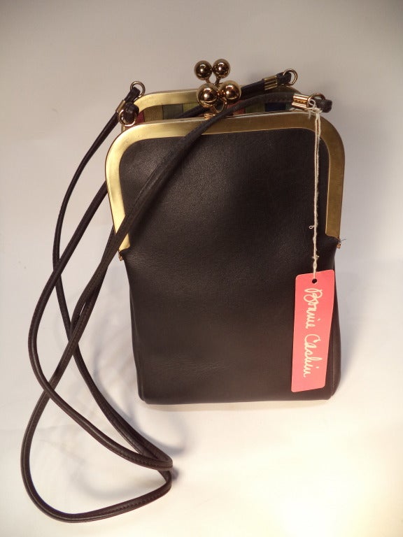 Bonnie Cashin joined Coach in 1963. She won her second Coty Award in 1968, a direct result of the line these bags come from. This is a deadstock (new-old/vintage unused) butter soft black leather handbag. There is an original hangtag - it is from a