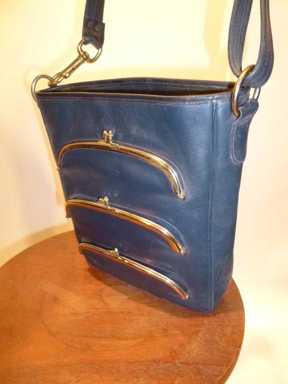 Bonnie Cashin joined Coach in 1963. She won her second Coty Award in 1968, a direct result of the line these bags come from. Check our other listings to see some of the others. This is a deadstock (new-old/vintage unused) butter soft navy blue