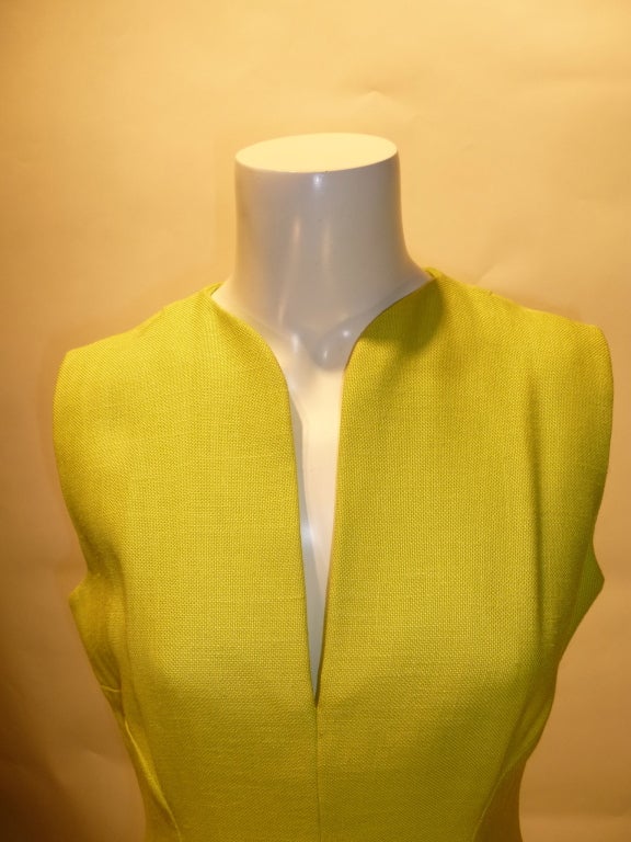 Gorgeous Pauline Trigere A-line sleeveless day dress in a lovely yellow-green chartreuse fabric. Form flattering seams and darts accentuate the body. Very simple architectural collar. No materials or sizing tags, but we think it's a heavy