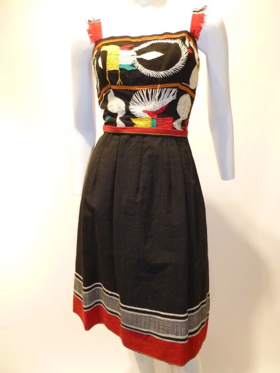 Beautiful vintage 1950s Tina Leser Original dress in a South or Central American Traditional style. There is no materials tag, but this is made from heavy cottons with beautiful embroidery. The lining is a synthetic fabric. There is a 16