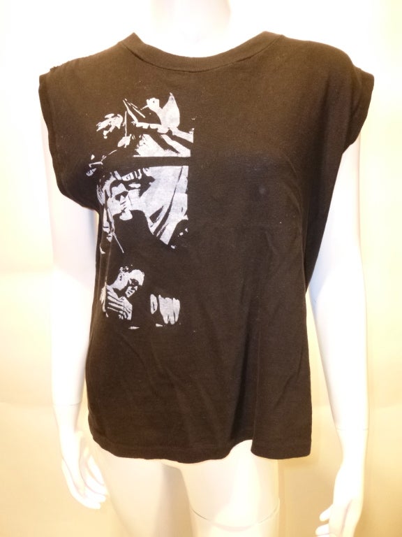 Influential Belgian electronic (EBM) band Front 242 T-shirt from the early 80s. The shirt is sleeveless as created, not cut-sleeved. Please note that the large image with the band name is the back of the shirt, while photo #2 is the front. Printed