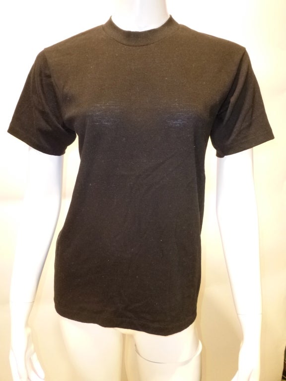 S.E. Hinton published the novel The Outsiders in 1967, and Francis Ford Coppola adapted it for film in 1983. This is a vintage 80s promotional T-Shirt for the film. The tag has vbeen washed nearly blank, but the shirt itself is still firm and
