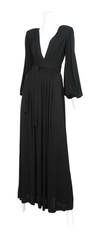 Rayon jersey gown with deep V-neckline and gather waistline with sash tie.