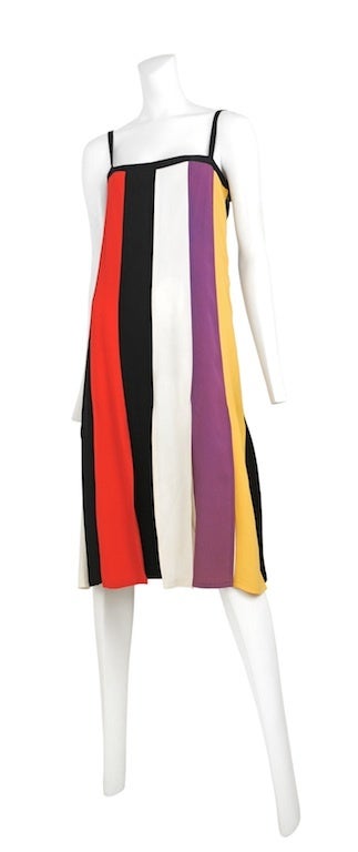 Crepe color block panel dress with black satin straps and square neckline. Slit at each panel just above the knee.