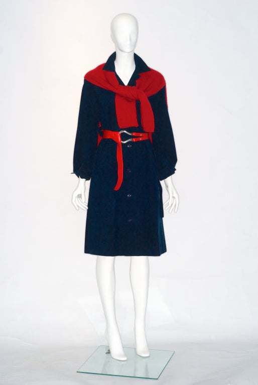 This deep navy blue ultrasuede shirtdress is one of the first and most popular of Halston's ultra suede designs.  Please note the cashmere sweater and Elsa Peretti belt are sold separately.

Halston is practically synonomous with ultrasuede. 