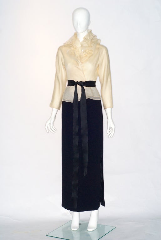Beautifully elegant Halston ruffled silk blouse and long black skirt with black ribbon belt.  Halston became enamored of ruffles in the late 1970s and early 1980s.  WWD nicknamed Halston 