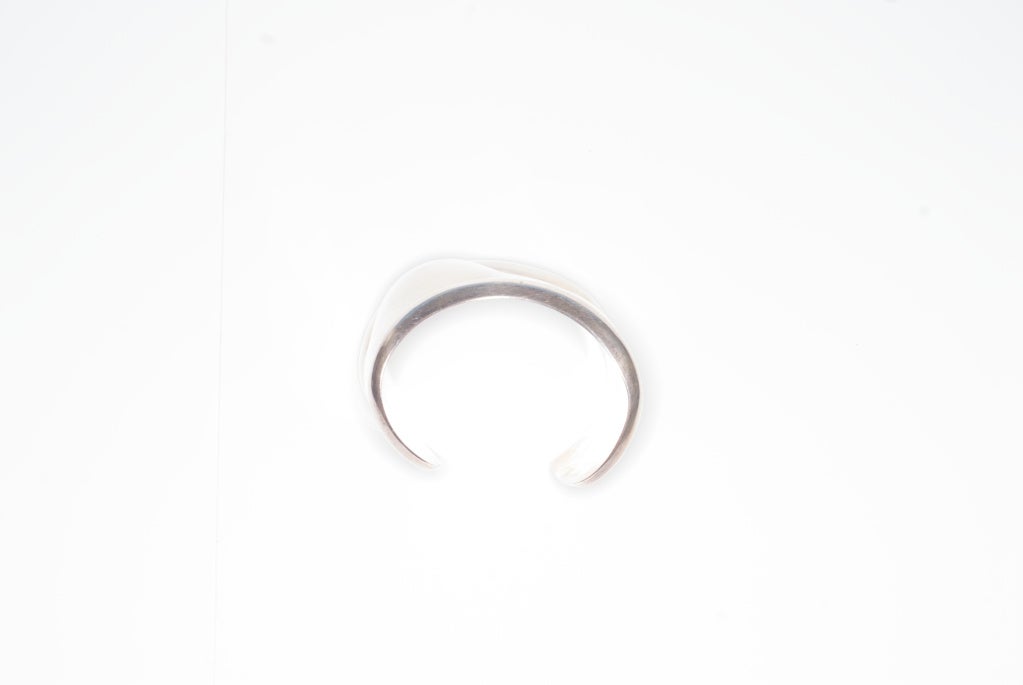 Elsa Peretti for Halston sterling silver bone cuff.  

In 1969, Elsa Peretti was modeling for Giorgio di Sant' Angelo when she realized she wanted to make jewelry. She started creating simple, abstract designs in wax and casting them in silver for