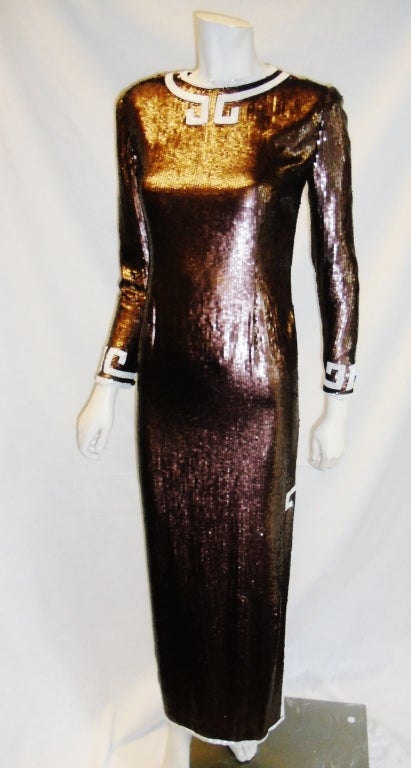 Incredibly beautiful Bill Blass Greek Inspired Gown. Made by Bill Blass's close friend and New York Socialite Circa 1980'. Copper fish-scale sequin over fine silk. Carefully executed with hand beaded detail finish.
Bust: 34