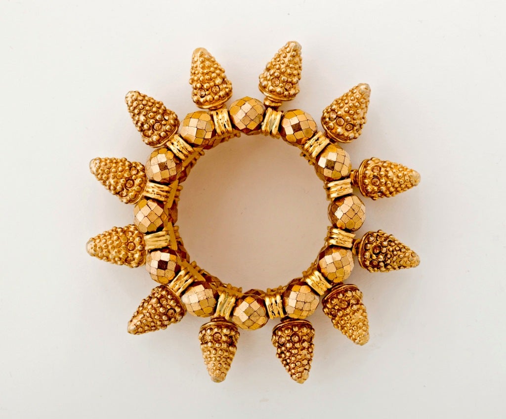 Circa 1980's comes this sensational Claire Deve Bracelet of gilt metal cones encrusted with topaz stones mixed with octagonal gilt lucite beads.  Quite the statement from this illustrious designer who also designed for Chanel, Jean Paul Gaultier and