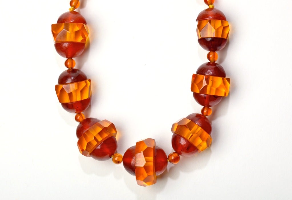 A lush apple juice and root beer bakelite necklace with amazing faceted detailing.