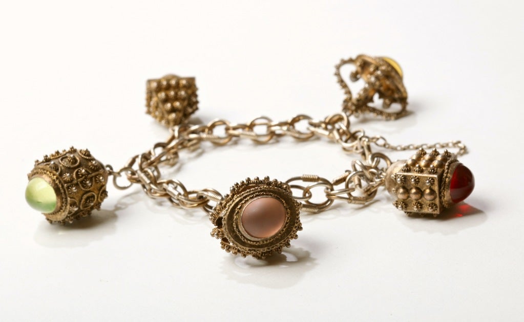 Gold Wash Etruscan Charm Bracelet with multi-colored poured glass cabochons charms on an intricate link bracelet.
