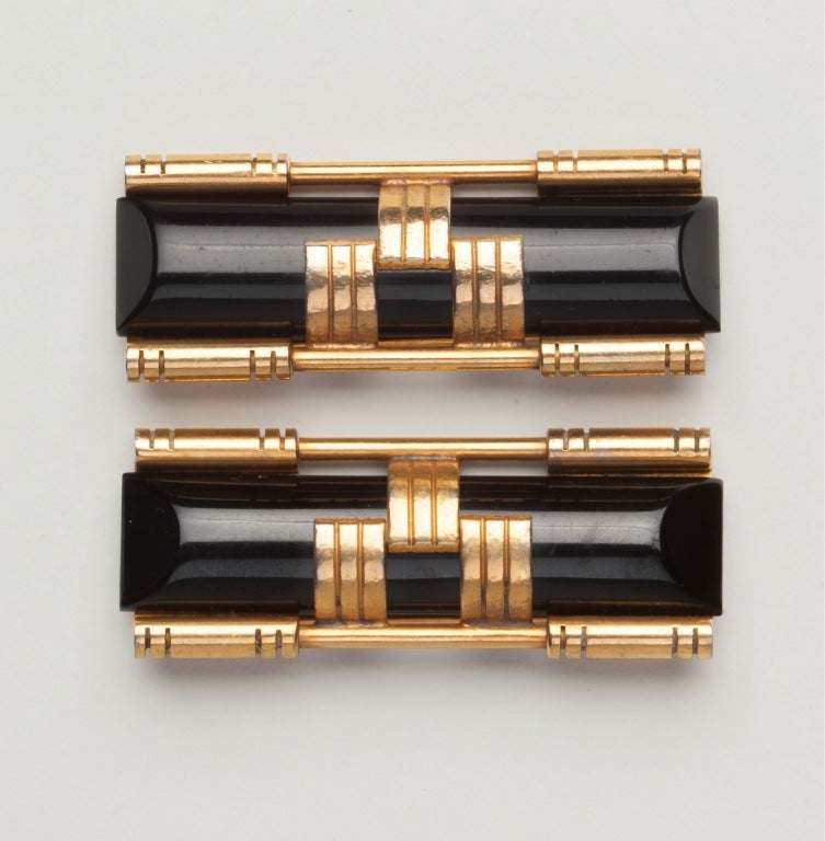 An Outstanding Pair of Matched Art Deco Brooches by the Jakob Bengel Factory in Germany with Black Galalith Bars set within Machine Age gilt metal mounts. Made for Fabon Fse and signed 