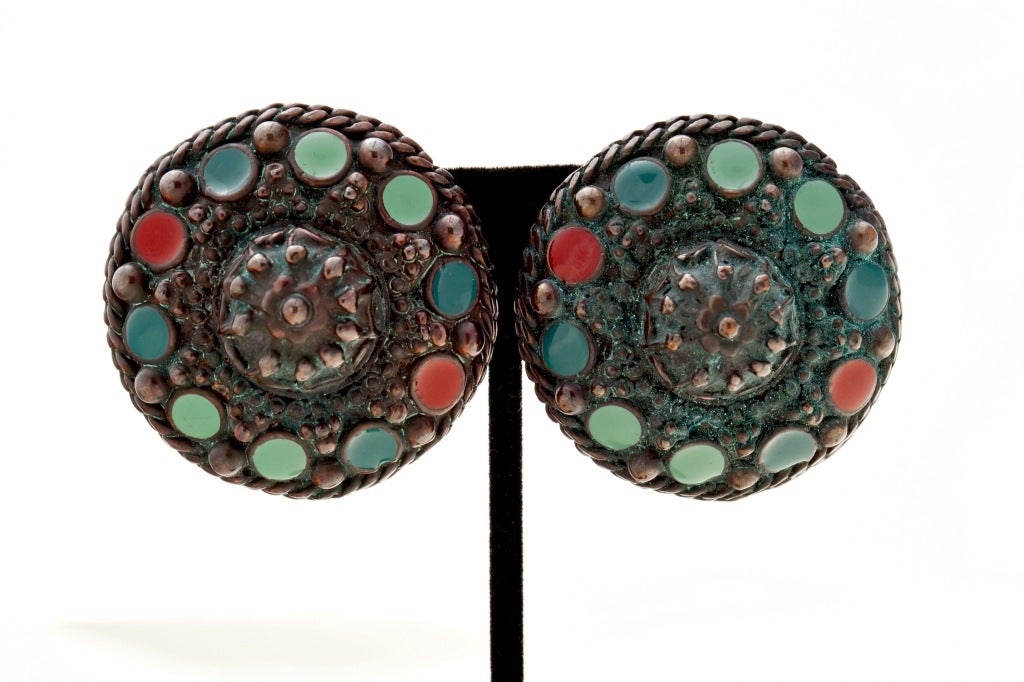 From the 80's comes this absolutely stunning pair of Jean Paul Gaultier copper and enamel runway etruscan/tribal earrings.  Intricately detailed with multicolored enamel circles with a raised floral center.  Unique and timeless clip earrings, signed