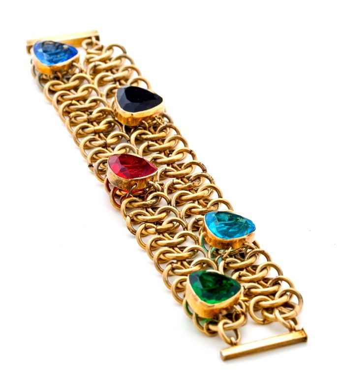 A Sensational Retro Chain Mail Paste Bracelet with multi colored faceted glass stones surrmounting a gilt metal chain link  bracelet, unsigned.