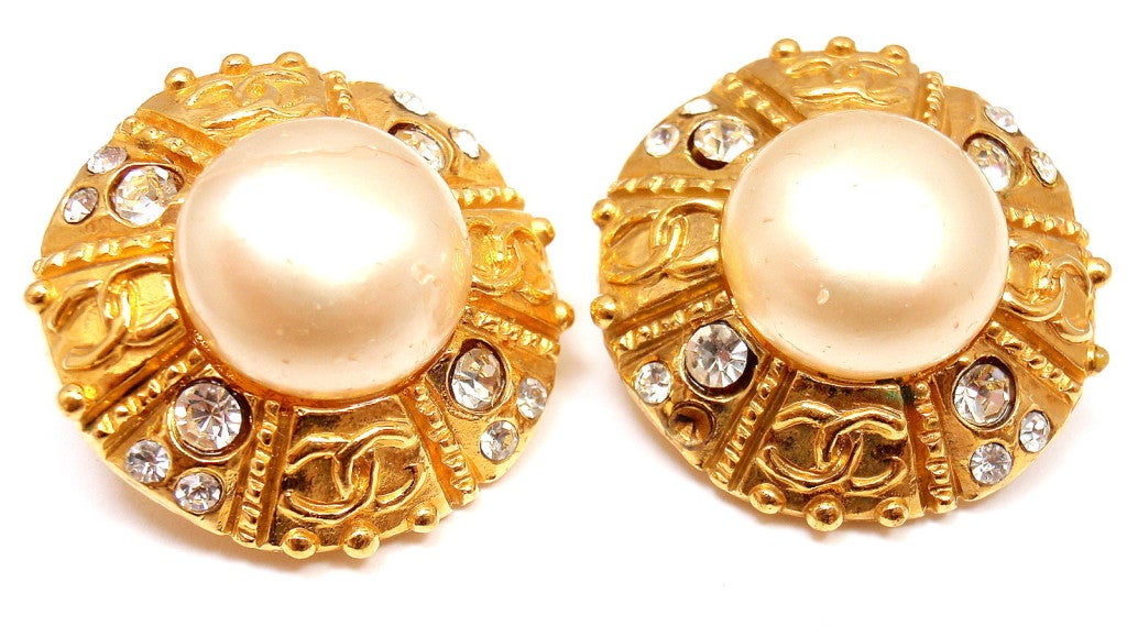 Gold Tone French Couture Collection Pearl Crystal Clip On Earrings by CHANEL. 

Measurements: 29mm
Weight: 30 grams
Stamped Hallmarks: Chanel Made in France
Free Shipping within the United States

YOUR PRICE: $600