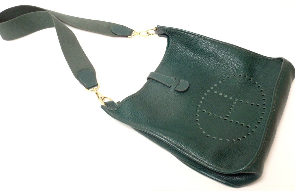This fabulous Hermes bag is in great condition. With vert fonce (dark green)  leather. Features amazing slouchy clemence leather exterior with sueded leather interior. 

Details: 
Size: 13 inches x 12.5 inches x 3.2 inches
Strap: 32.5'' total