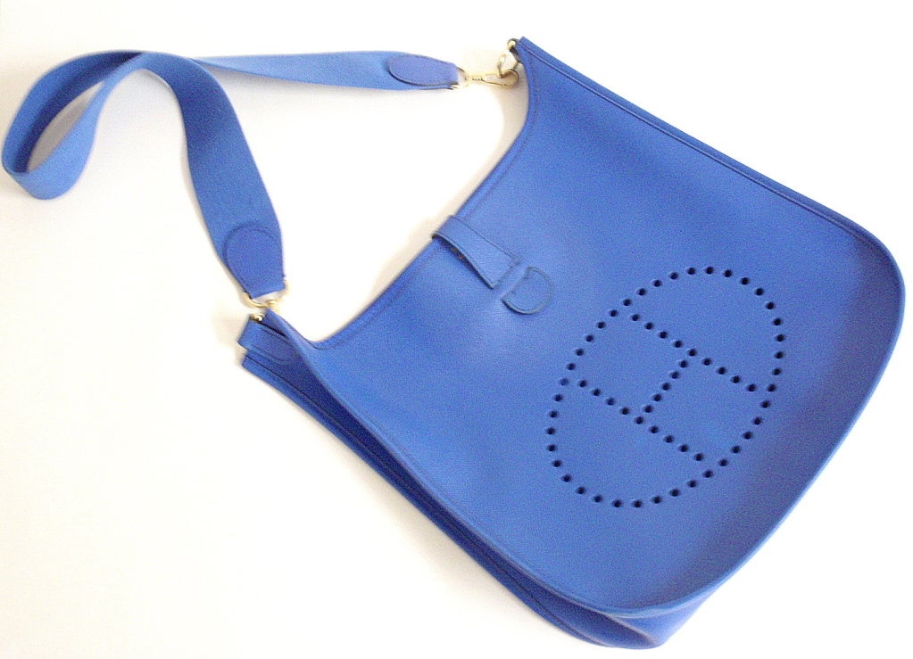 Evelyne GM Courchevel Leather Blue Hydra Should Bag by Hermes. This bag is in great condition. Very little flaws.

Measurements: 13 inches x 12.5 inches x 3.2 inches

Strap: 30'' total length, when folded, the drop from top of fold to top of bag