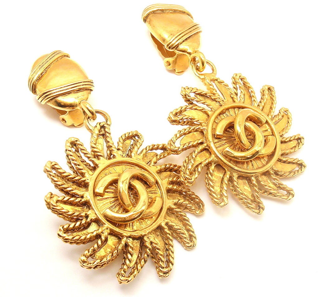 Vintage French Couture Collection Gold Tone CC Logo Soleil Large CLip-On Earrings from CHANEL. 

Measurements: 42mm x 76mm
Weight: 54.9 grams
Stamped Hallmarks: Chanel Made in France

*Free Shipping within the United States*

YOUR PRICE: $750