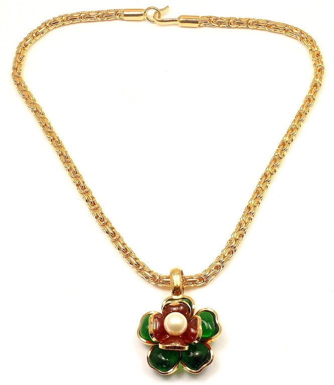 Vintage Gripoix Glass Camelia FLower Necklace from CHANEL. 

Measurements: 16'' long, pendant is 40mm (including bale) by 30mm
Weight: 46.6 grams
Stamped Hallmarks: Chanel, made in France

*Free Shipping within the United States*

YOUR