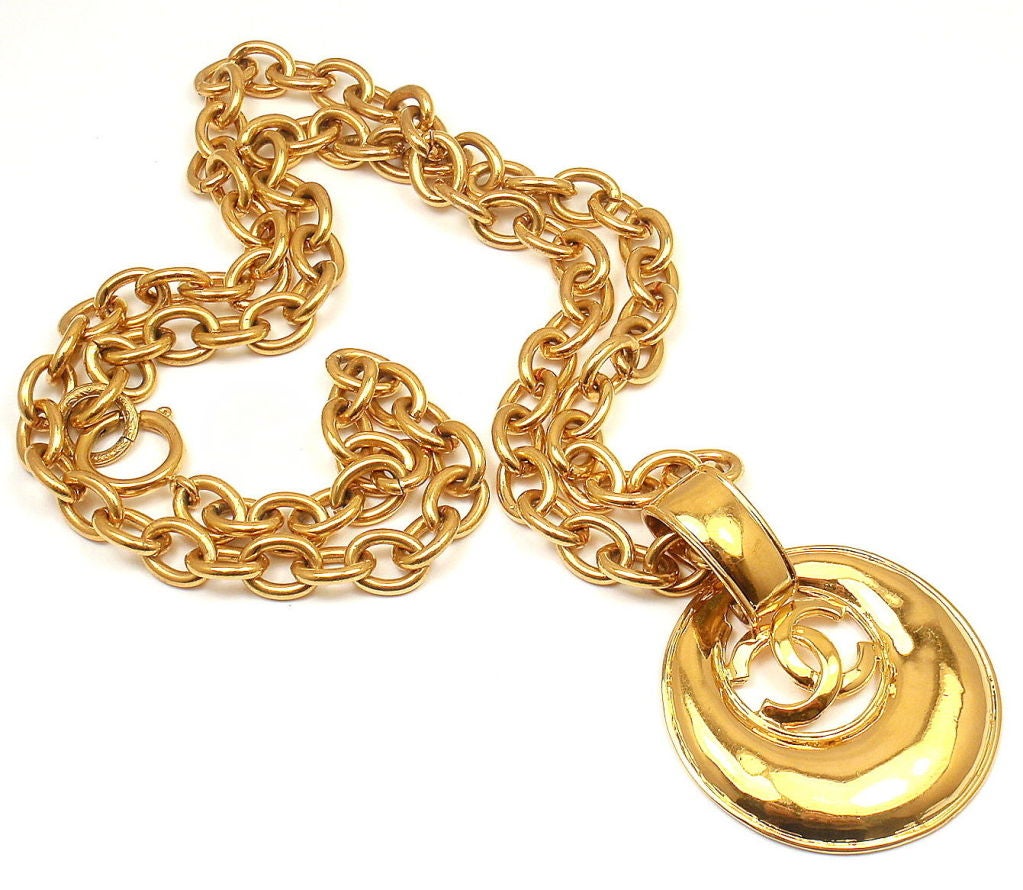 Vintage French Couture Collection Gold Tone Double CC Signature Logo Amulet Long Necklace from CHANEL. 

Measurements: 30'' long, pendant is 3