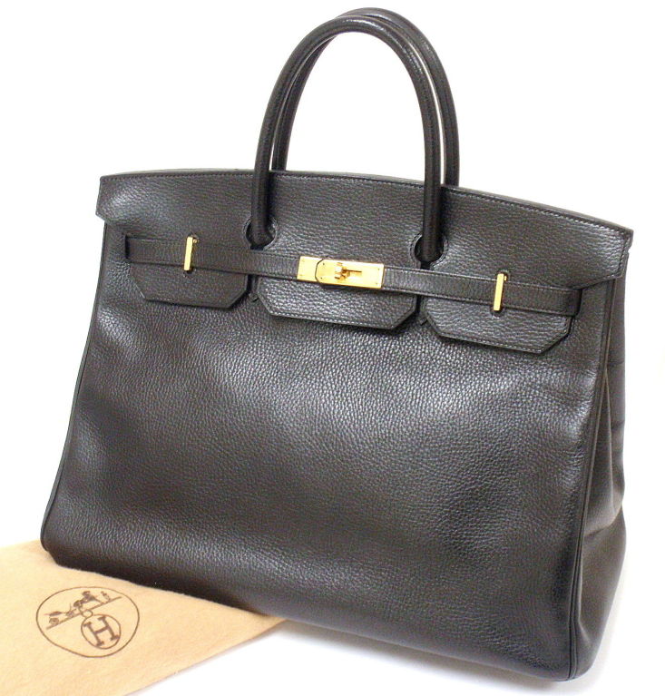 AUTHENTIC! GREAT CONDITION HERMES 40CM BLACK ARDENNES BIRKIN HANDBAG, 1995

Comes with clouchette with key.

*Please note, color may not be fully representative of handbag based on monitor and lighting. This handbag is a true Hermes gold (sunny)