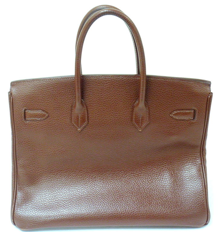 AUTHENTIC GREAT CONDITION HERMES 35CM BROWN ARDENNES BIRKIN HANDBAG, YEAR 2002
Comes with clouchette with key.

*Please note, color may not be fully representative of handbag based on monitor and lighting. This handbag is warm caramel brown tone