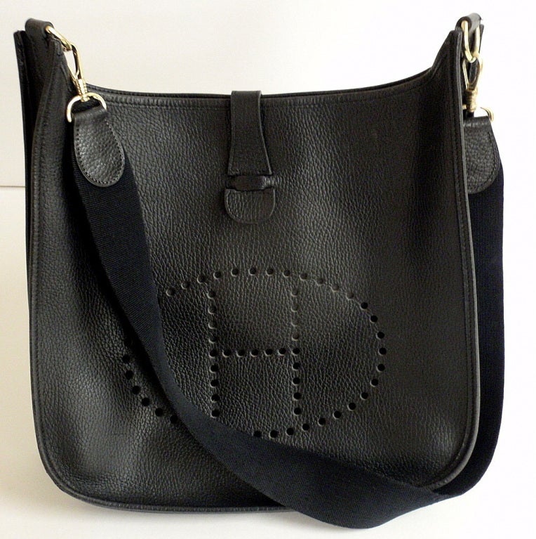 HERMES Evelyne 2PM Black Clemence Leather SHW Shoulder Bag. This fabulous handbag features clemence leather exterior with sueded leather interior. 

Details: 
Measurements: 11 inches x 10.8 inches x 3.5 inches, 19.6 strap drop
Stamped Hallmarks: