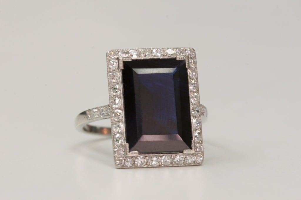 6.16ct sapphire with 0.85cttw Single cut accent diamonds set in a vintage platinum mounting. Circa 1920