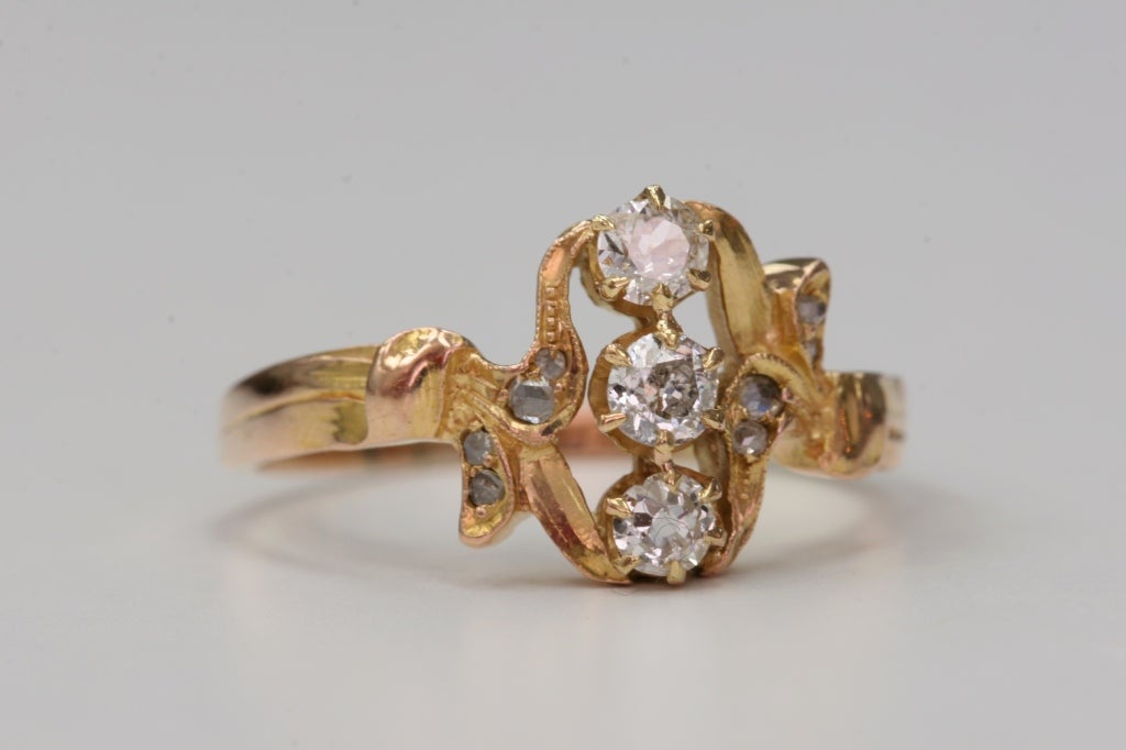 0.48cttw old Mine cut diamonds set in a vintage 15kt yellow gold mounting. Circa 1880
