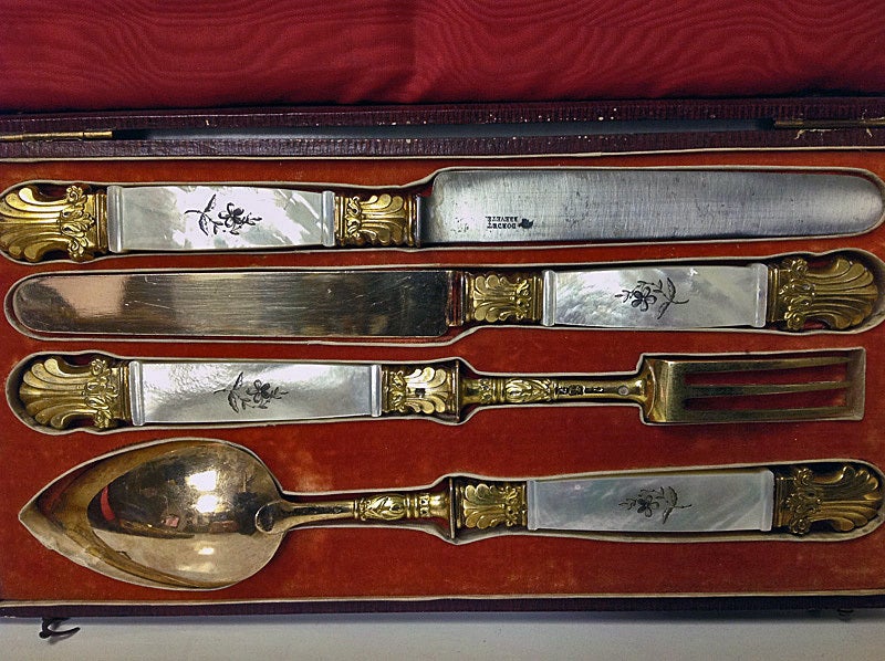 Pair of .950 1st std French, vermeil and mother of pearl Travelling Sets in original fitted boxes. France 1819-38. The exceptionally fine quality sets each comprising a spoon, fork and two knives, one with original steel blade stamped Dordet Brevte,