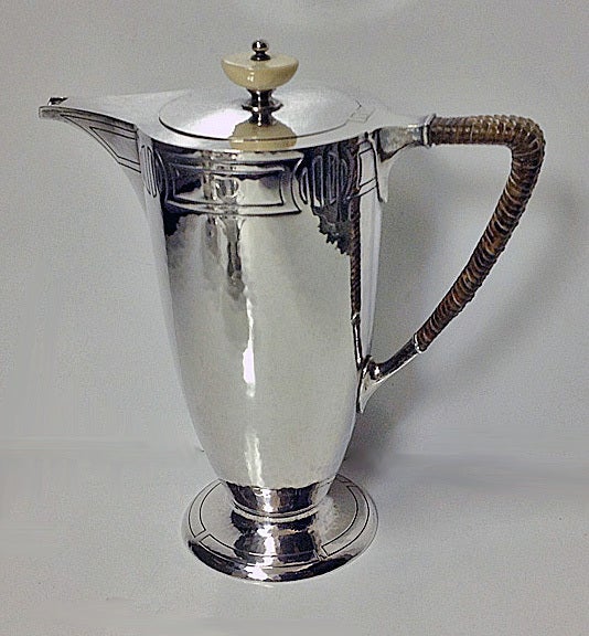 American Arts and Crafts Sterling hammered Silver Coffee Service, C.1905, Wm. Durgin Co, Providence, Rhode Island. The Service of hand beaten design, each piece on a spreading circular footed base, the upper and lower parts of the body with incised
