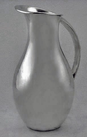 Mid 20th century Danish style Sterling Water Pitcher Jug, Juvento Lopez Reyes, Mexico, C.1950. The Jug of plain tapered bulbous form, curvilinear handle, elongated everted rim and spout. Stamped on underside Sterling 925 and makerâ??s mark for