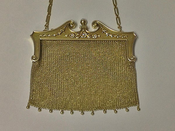 Art Nouveau 18K/14K Diamond  Pearl mesh link purse, C.1910. Total Item Weight: 184 gm.The purse of mesh link tassle drops, festoon decorated front mount set with three small old cut diamonds, reverse mount with engraved scroll foliate decoration,
